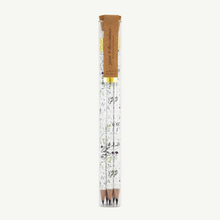 Load image into Gallery viewer, A set of 5 pencils in a glass propogation tube that is sealed with a cork. Each pencil is already sharpened and has delicate herb designs along the white barrel.
